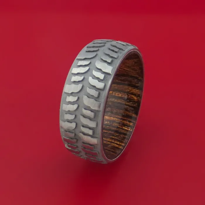 Rings Lashbrook Titanium Ring with Mud Tire Tread Pattern Inlay and Interior Hardwood Sleeve Custom Made Band Rings Lashbrook Titanium Ring with Mud Tire Tread Pattern Inlay and Interior Hardwood Sleeve Custom Made Band